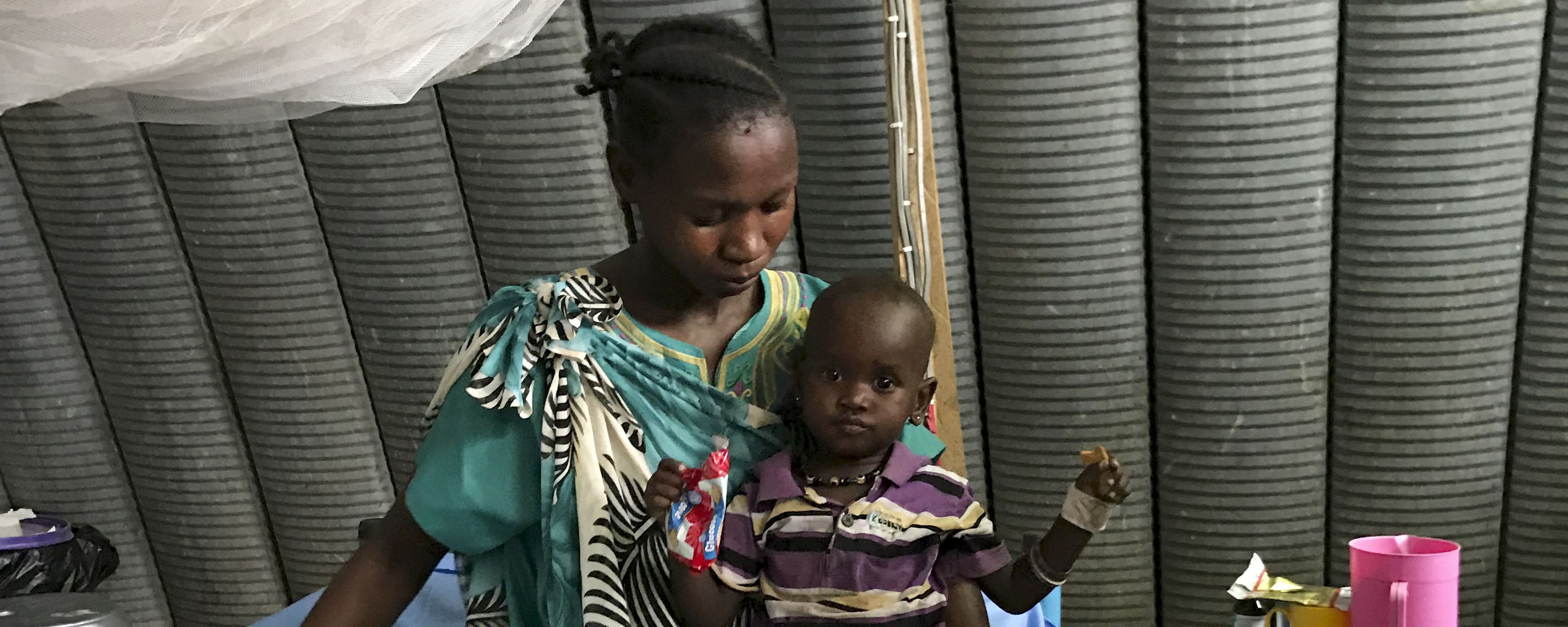 A woman with her child in the International Medical Corps hospital in Juba, South Sudan. Image by Jane Ferguson. South Sudan, 2017.