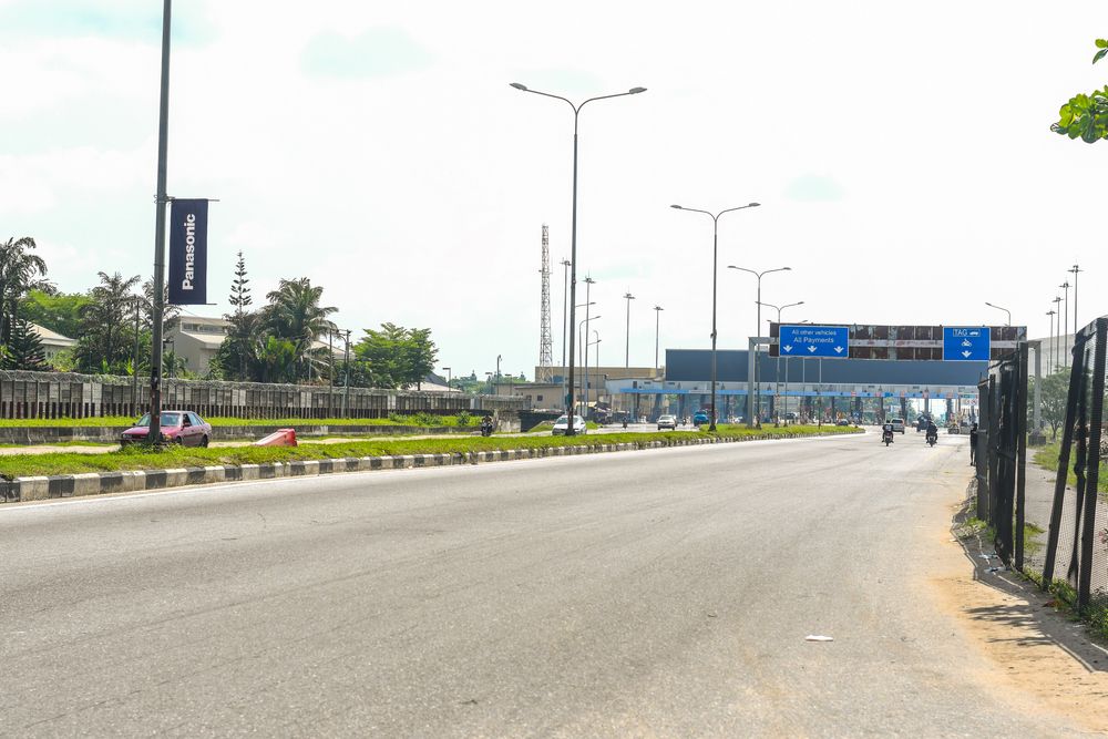 The otherwise very busy Lekki-Epe expressway, looking scanty due to the lockdown order in Nigeria by the government, to stop the spread of the coronavirus. Image by Santos Akhilele Aburime / Shuttertsock.com. Nigeria, 2020.