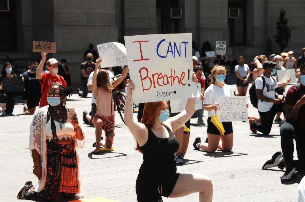 Hundreds of Philadelphians kneel in protest of system police violence and other forms of systemic racism in memory of George Floyd and other victims modern-day lynching at City Hall in Philadelphia, PA, on May 30, 2020. Image by Cory Clark/NurPhoto via Getty Images. United States, 2020.
