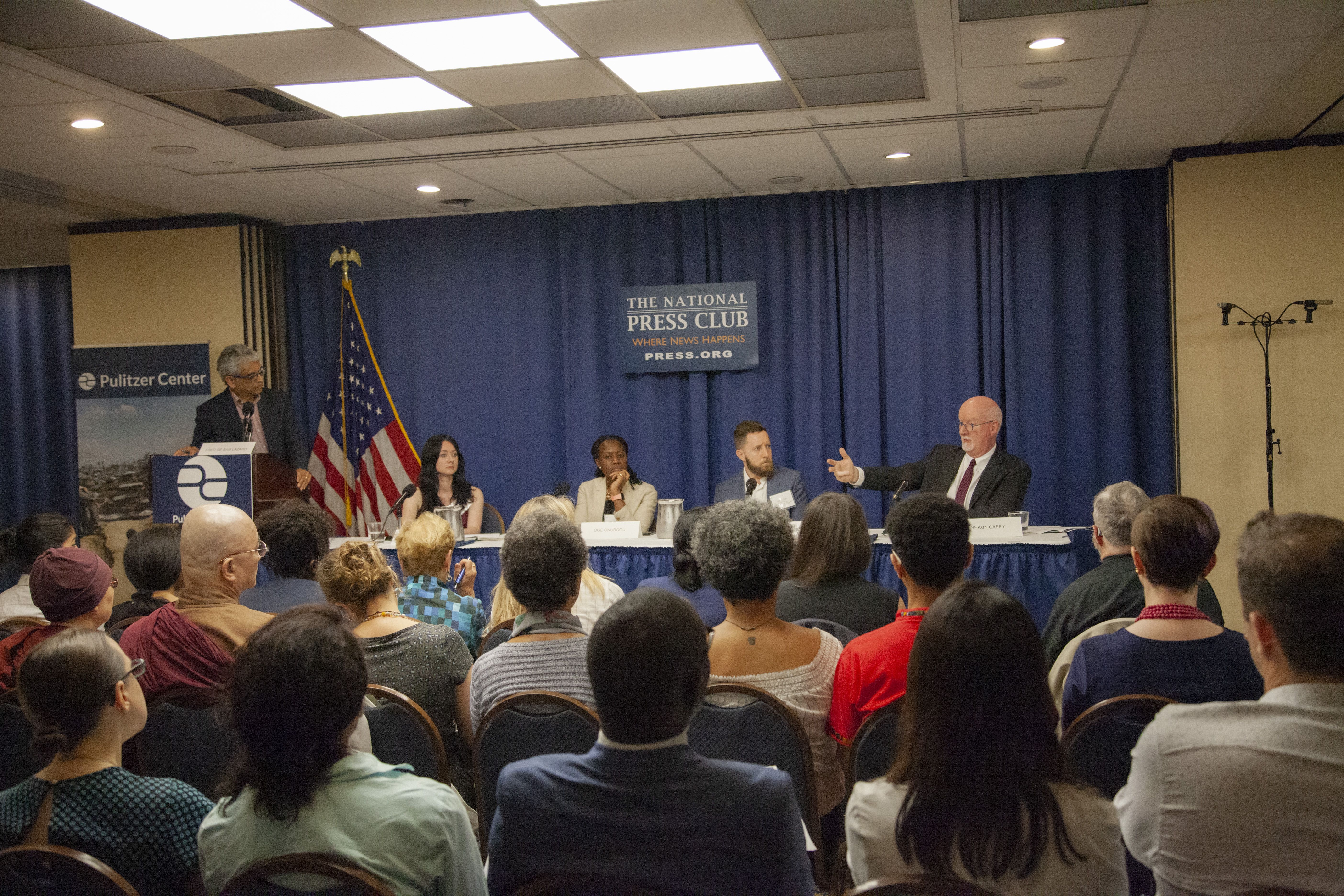 Fred de Sam Lazaro (far left) discusses religion and peacebuilding with Cathy Otten (second from left), Oge Onubogu (center), Danny Gold (second from right), and Shaun Casey (far right). Image by Jin Ding. Washington, D.C., 2019.