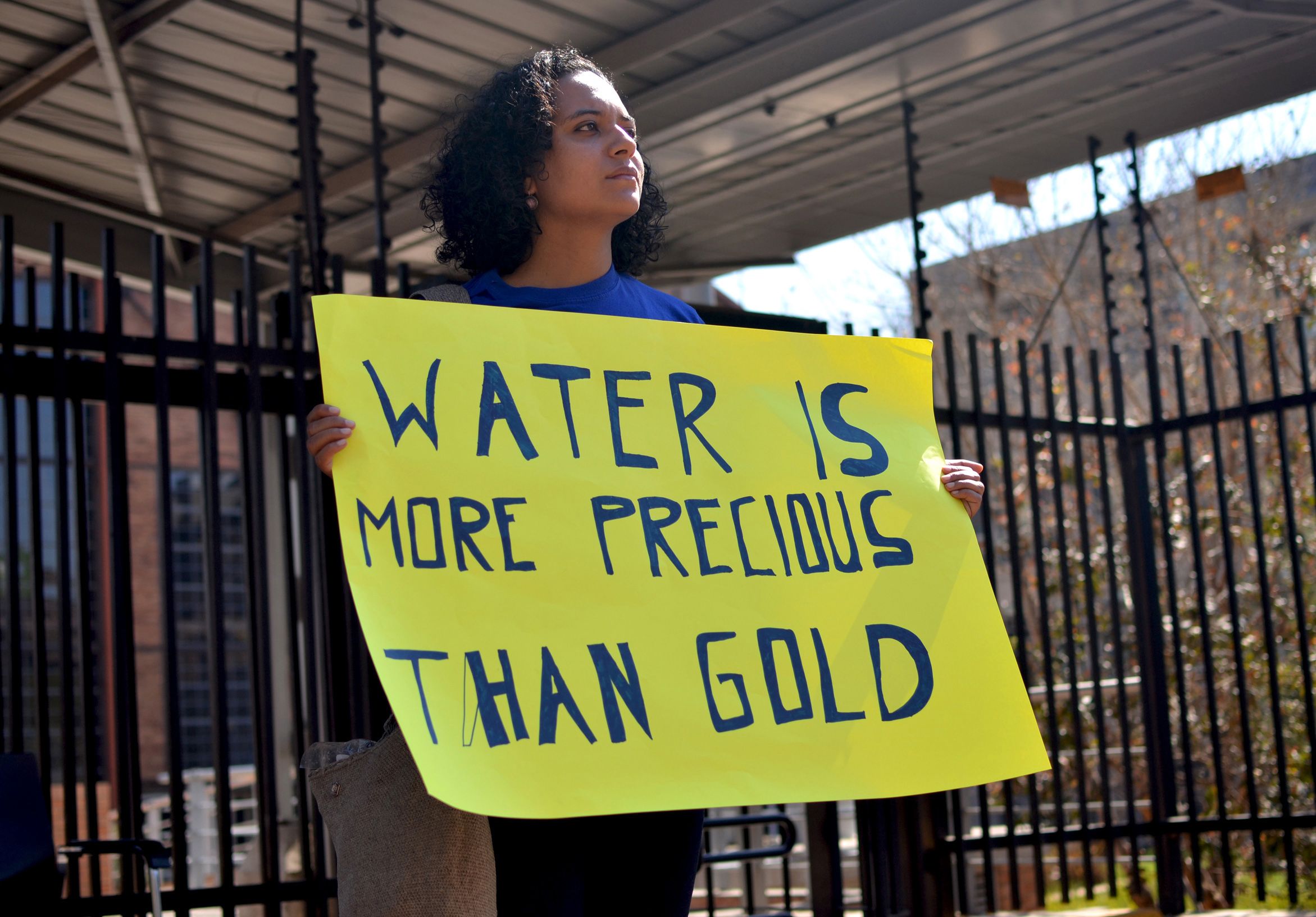 Colombian activist Ximena Gonzalez protests outside AngloGold Ashanti's headquarters in Johannesburg in 2016. Image by Mark Olalde. South Africa, 2016.