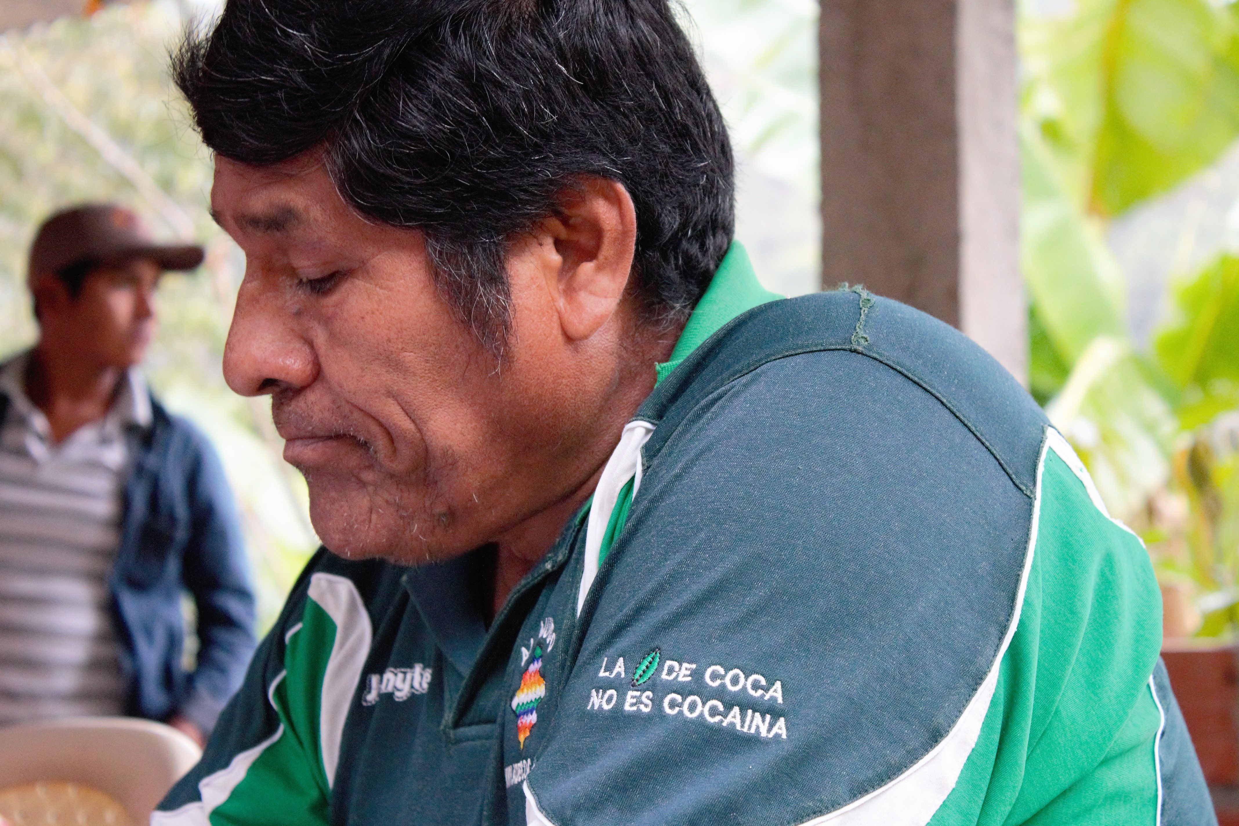 Don Mario, a coca producer in Yungas, Bolivia, has a t-shirt that reads “coca no es cocaína," (coca isn't cocaine). Image by Alice Campaignolle. Bolivia, undated.