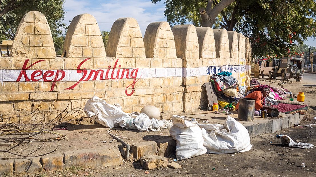 "Keep Smiling" is emblazoned on a wall in Jaisalmer. Image by Micha Weber / Shutterstock.com. India, 2016. 