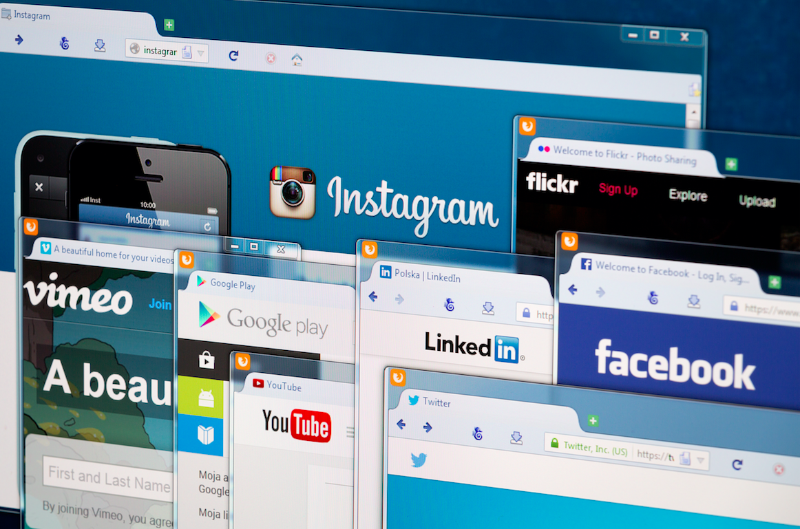 Photo of social network homepage on a monitor screen. Image by REDPIXEL.PL / Shutterstock. Poland, 2014.