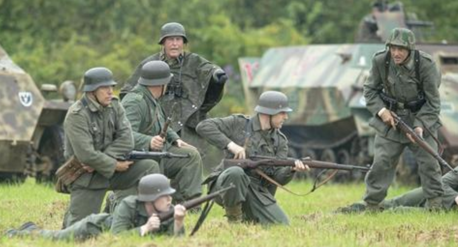 World War II Days is one of the best money-making events for Midway Village Museum, which like other museums across the country is struggling financially amid the coronavirus pandemic. Soldiers participate in a battle re-enactment Saturday, Sept. 21, 2019, at Midway Village in Rockford. Image by Chris Nieves/rrstar.com correspondent. United States, 2019.