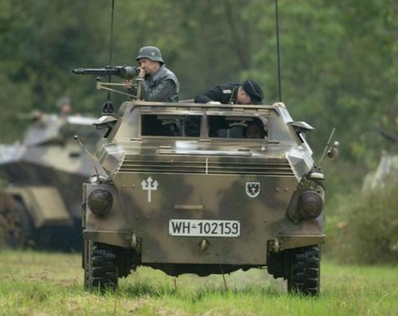 Re-enactors playing German soldiers drive into battle during World War II Days on Saturday, Sept. 21, 2019, at Midway Village in Rockford. Events such as World War II Days are some of the biggest draws at the museum. Image by Chris Nieves/rrstar.com correspondent. United States, 2019. 