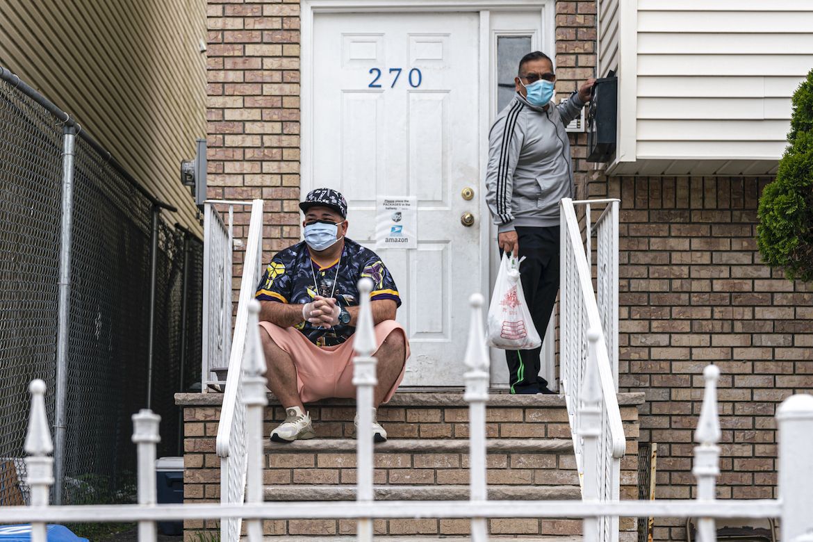 On the left, Mike Ruiz Rivera, a native of Ponce and a resident of Newark, New Jersey, is a 42-year-old man who survived COVID-19 after more than half a month hospitalized. Image by by Hiram Alejandro Durán / Center for Investigative Journalism. United States, 2020.