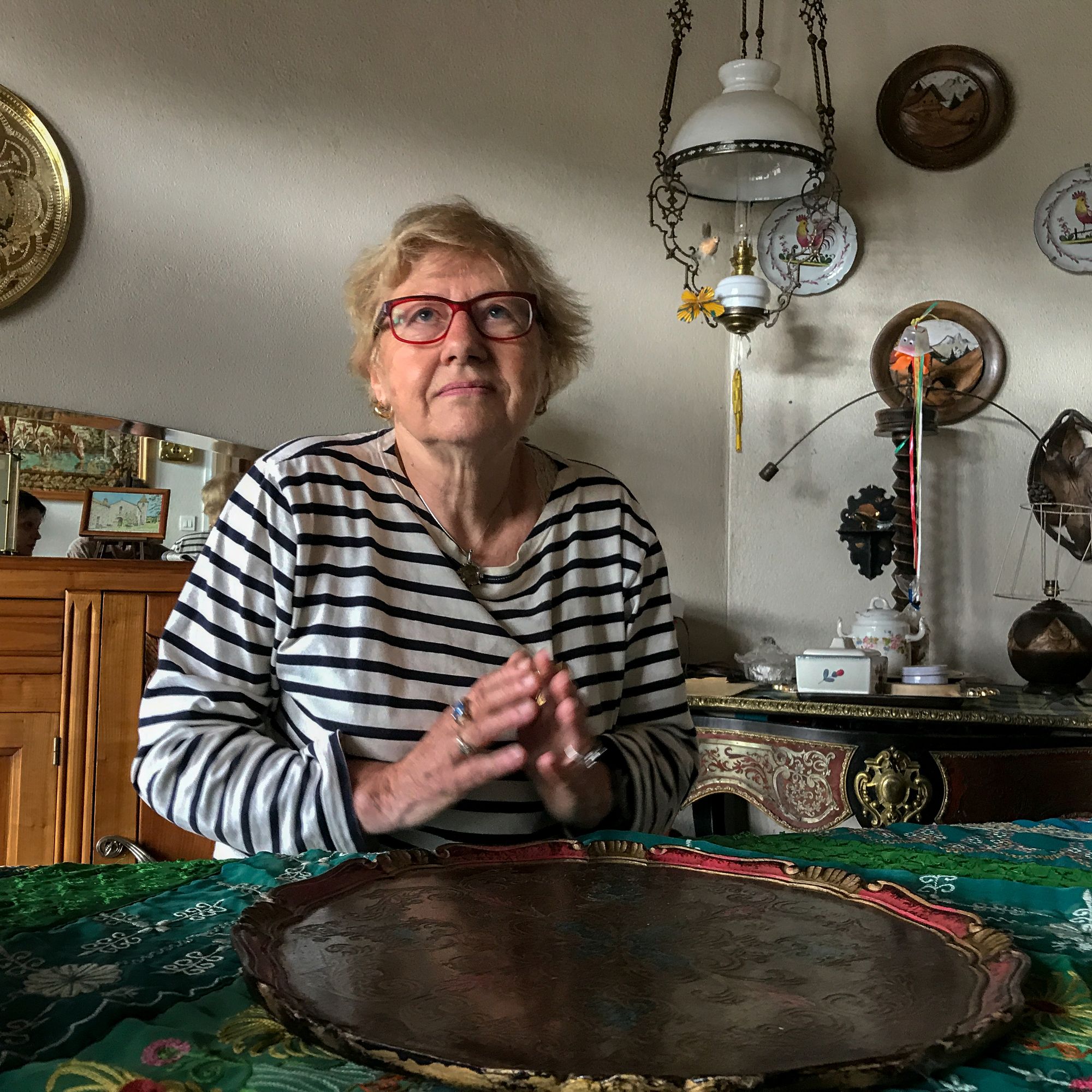 In Mazet-Saint-Voy, 75-year-old Yolande Chabanas tells the story of how her parents hid Jews in holes they dug under the coal piles the family sold. One time, when German soldiers came in to search the house, her mother offered them food and drink in the kitchen where they sat until an officer came by to check up on them. They told him that they had already searched the house and found no one. Image by Lucian Perkins. France, 2018.