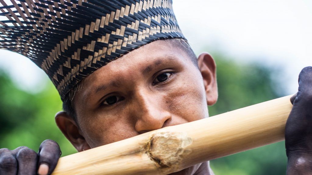 The sound of the bamboo flute signals a ritual. Image by Matheus Manfredini. Brazil, 2019.