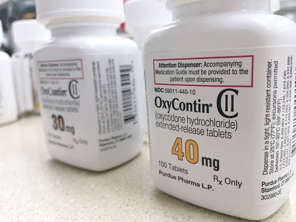 OxyContin bottles sit on a counter in Ogden, Utah. Image by PureRadiancePhoto / Shutterstock.com. United States, 2018.