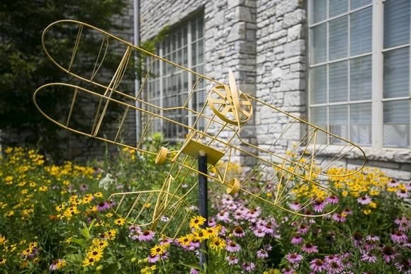 The museum's Waukesha Hangar features wildflowers and sculptures at Vintage Wheels & Wings Museum in Poplar Grove. Image by Scott P. Yates/Rockford Register Star. United States, 2020.