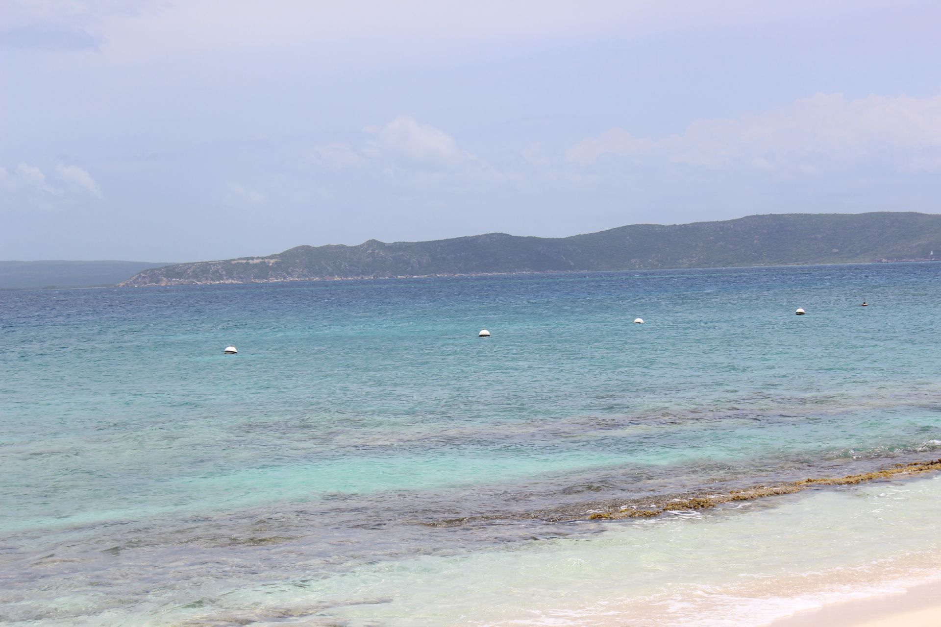 View of the Island of Kingston, Jamaica, from Lime Cay Beach, an islet in Jamaica. Image by Monica Long. Jamaica, 2018.