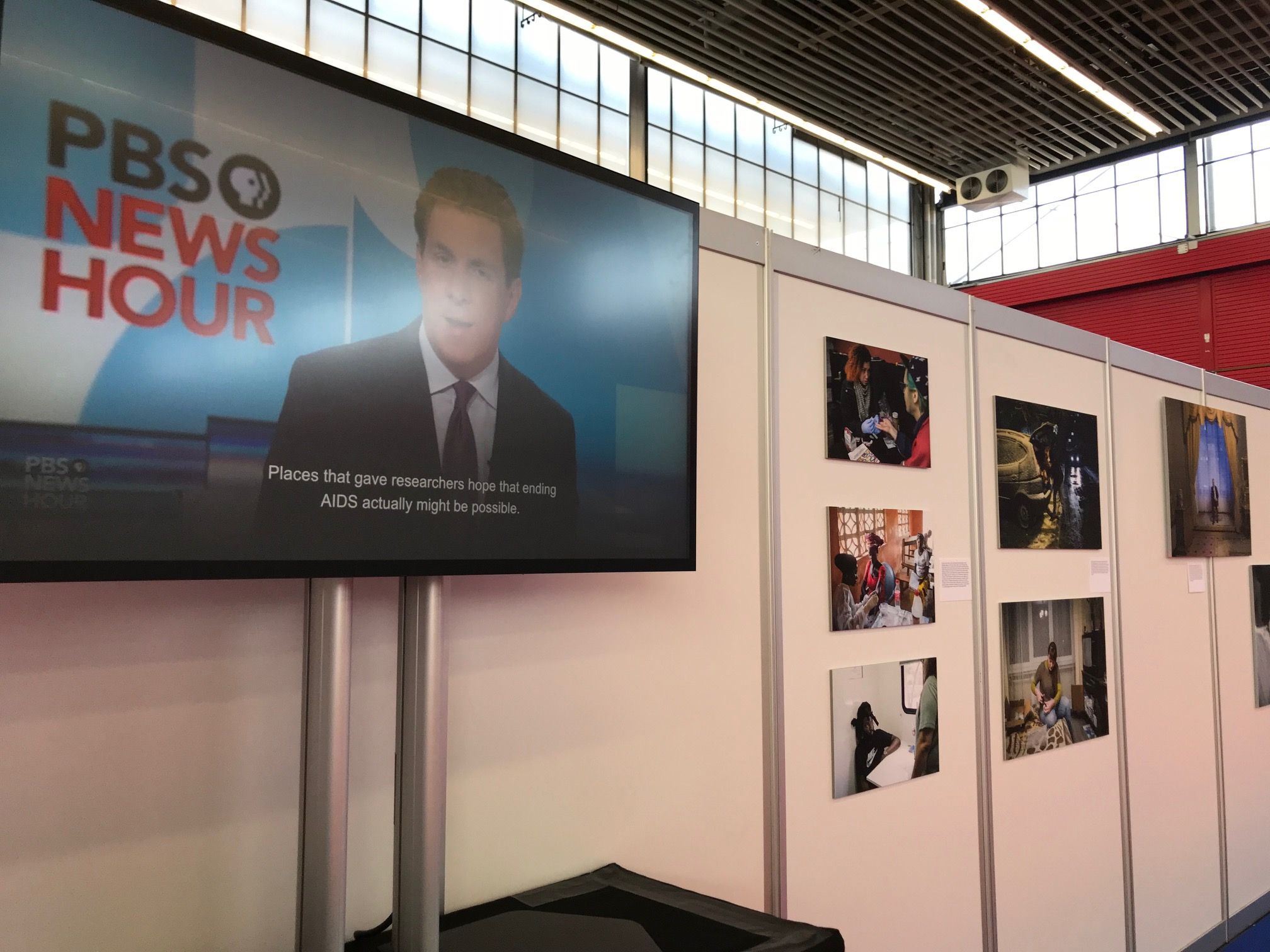 A segment of the Science Magazine and PBS NewsHour "Far From Over" exhibit at the 2018 International AIDS Conference in Amsterdam. Image courtesy of Jon Cohen. The Netherlands, 2018.