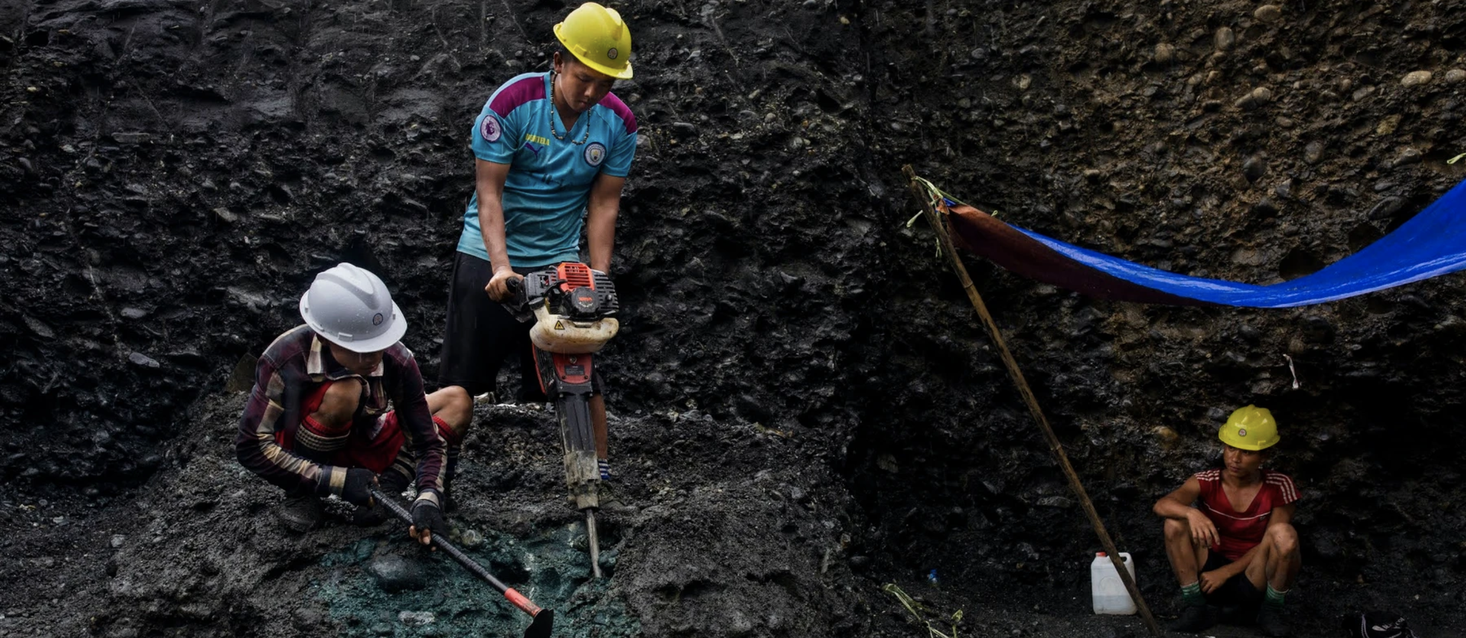 Freelance miners use jackhammers to search for jade in a Myanmar mine. Image by Hkun Lat. Myanmar, 2020.