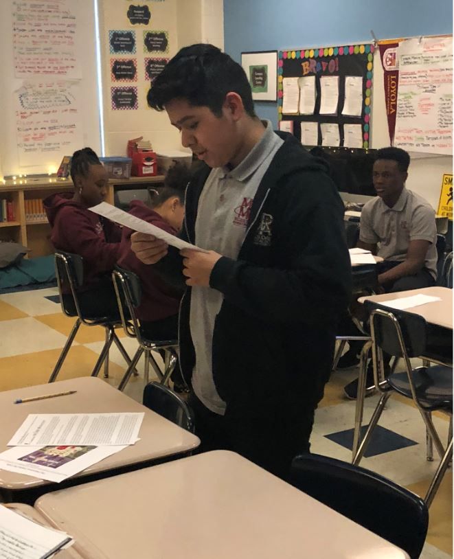 A student at Miles Davis Magnet Academy performs their Fighting Words poem. Image by Hannah Berk. United States, 2019.