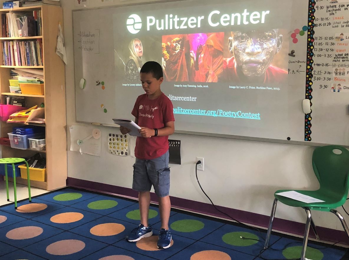A 3rd grade student at Washington Yu Ying Public Charter School in D.C. performs their Fighting Words poem for the class. Image by Hannah Berk. United States, 2019.