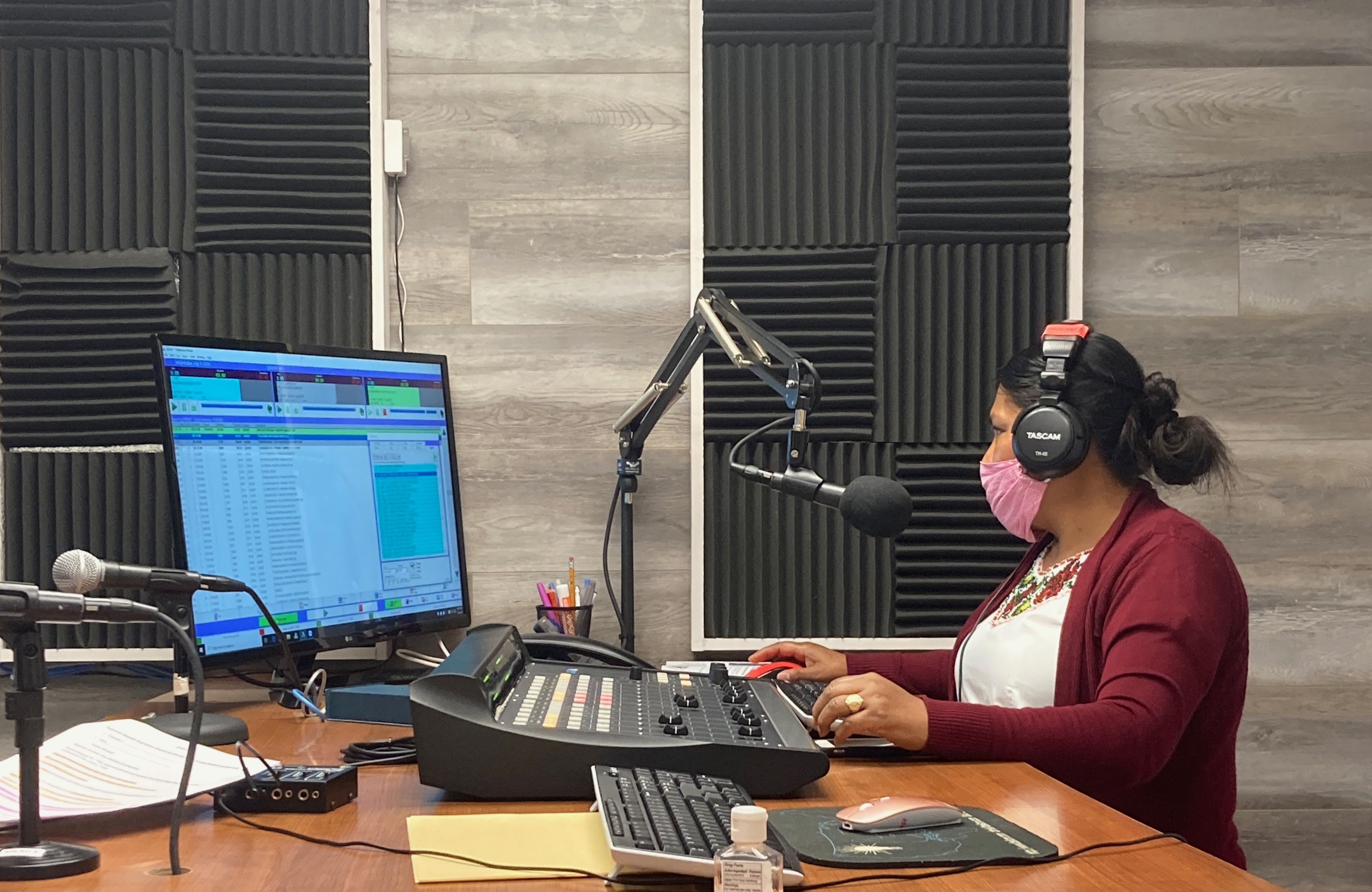 Lidia López prepares her program for Radio Indígena in Oxnard. Image by Julia Knoerr. United States, 2020.