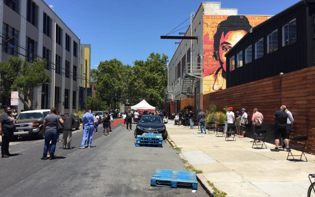 People waiting in line at the Mission COVID-19 mobile testing site at 701 Alabama Street on July 9, 2020. Image by Michael Toren. United States, 2020.