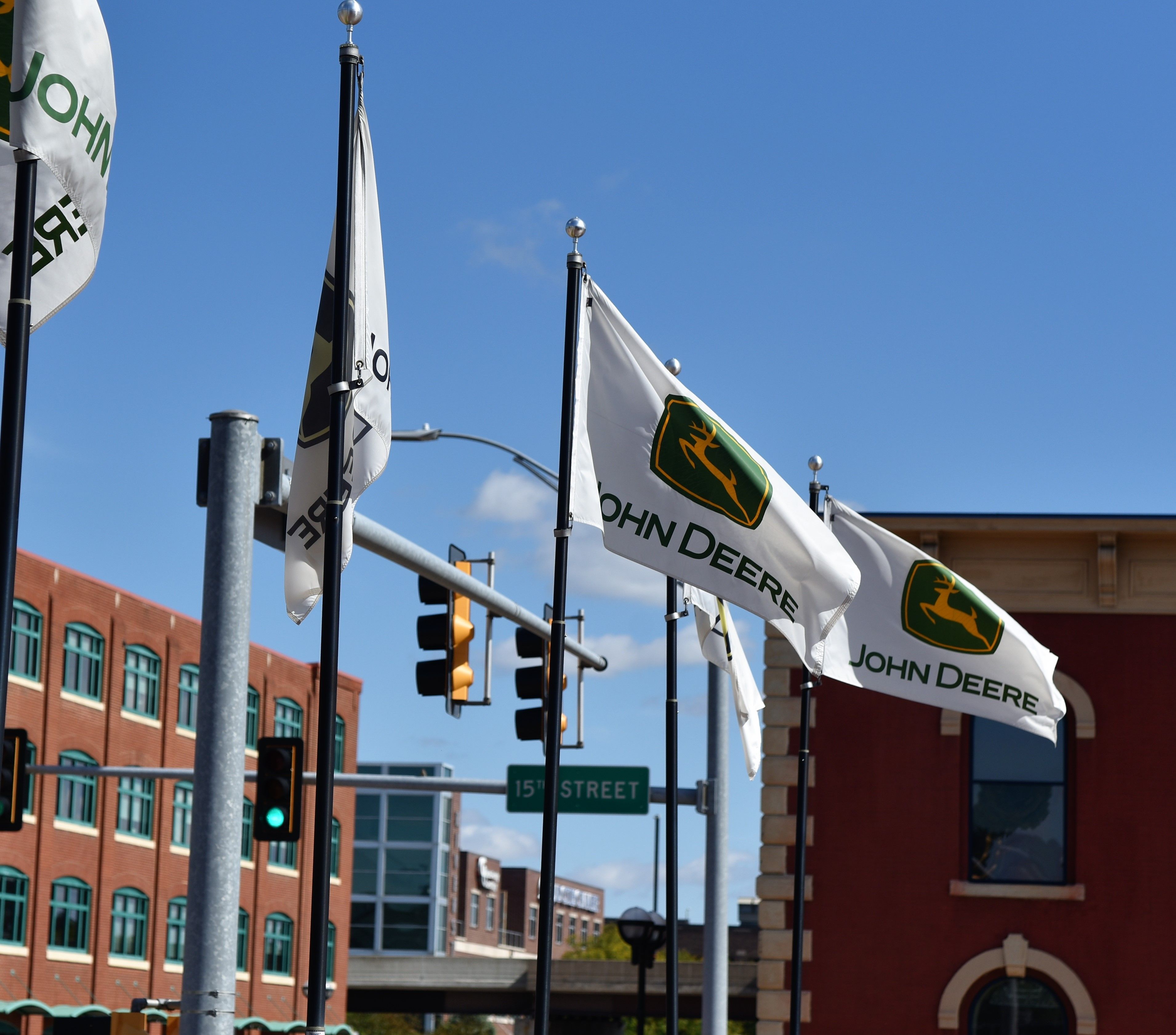September 2018, Moline, IL, John Deere Flags waving in front of the Pavilion. Image by Florida Chuck/Shutterstock. United States, 2018.