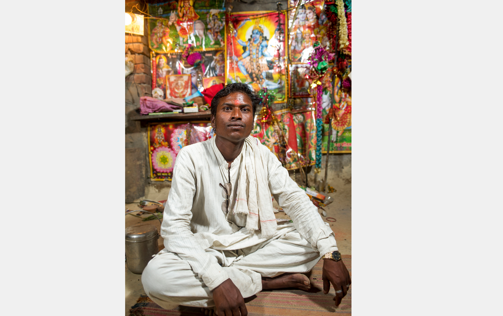  Rajesh Vanvasi has come a long way since he and his family were rescued from a kiln eight years ago and left for dead below a bridge by the kiln’s vengeful owner. In February, he was elected representative of his home village in Uttar Pradesh. Although he lives a busy life, he makes time to pray twice a day at his private shrine. “I wish for my and everyone’s troubles to go away,” he says. “I feel calmer now that I pray.”  Image by Ann Hermes. India, 2016.