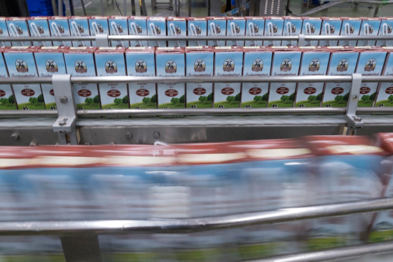 Fresh milk that is shelf-stable for up to nine months is packaged at the Pakchong Dairy Cooperative in Pak Chong, Thailand. Image by Mark Hoffman. Thailand, 2019. 