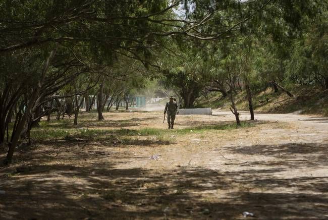 A Mexican soldier patrols an area near the banks of the Rio Grande in Matamoros, Tamaulipas. Image by Miguel Gutierrez Jr. Mexico, 2019.