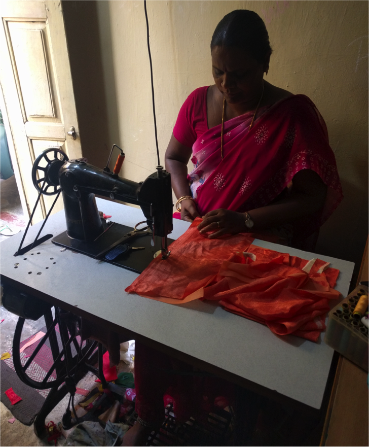 Gunasundari, now a successful tailor, learned her craft for free through classes at the Ulaga Matha Church in Thiruvannamalai. Image by Praveena Somasundaram. India, 2017.