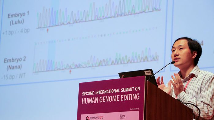 He Jiankui presented a slide at a Hong Kong, China, genome-editing summit that showed DNA sequences from the edited CCR5 genes in the twin girls. Image courtesy of National Academies/Flickr. China, 2019. 