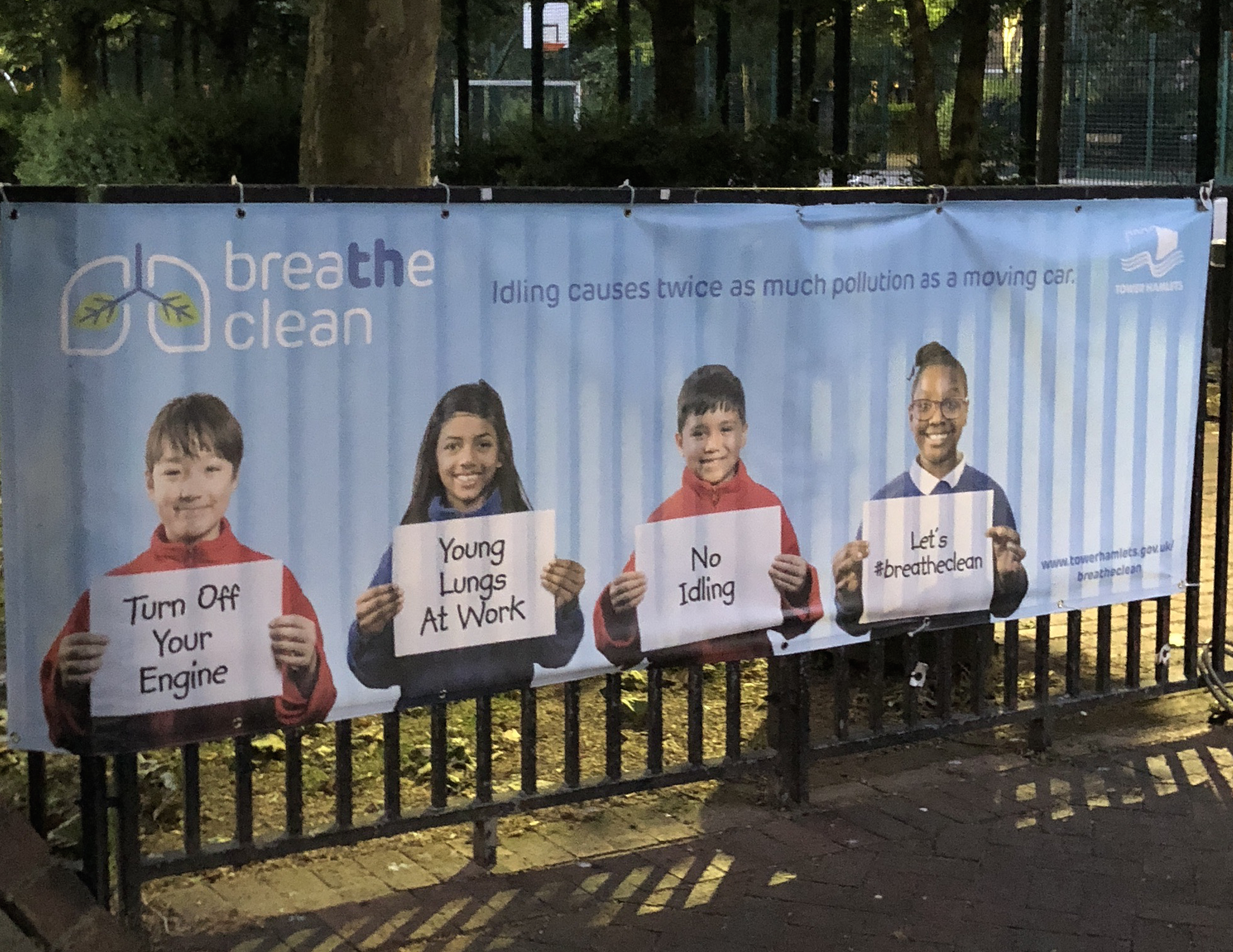 Campaigns such as "Breathe Clean" in the U.K. emphasize the threat that air pollution poses to children. This poster, taped to the gate of a park, aims to bring awareness to both children and parents. Image by Rohan Naik. United Kingdom, 2018.