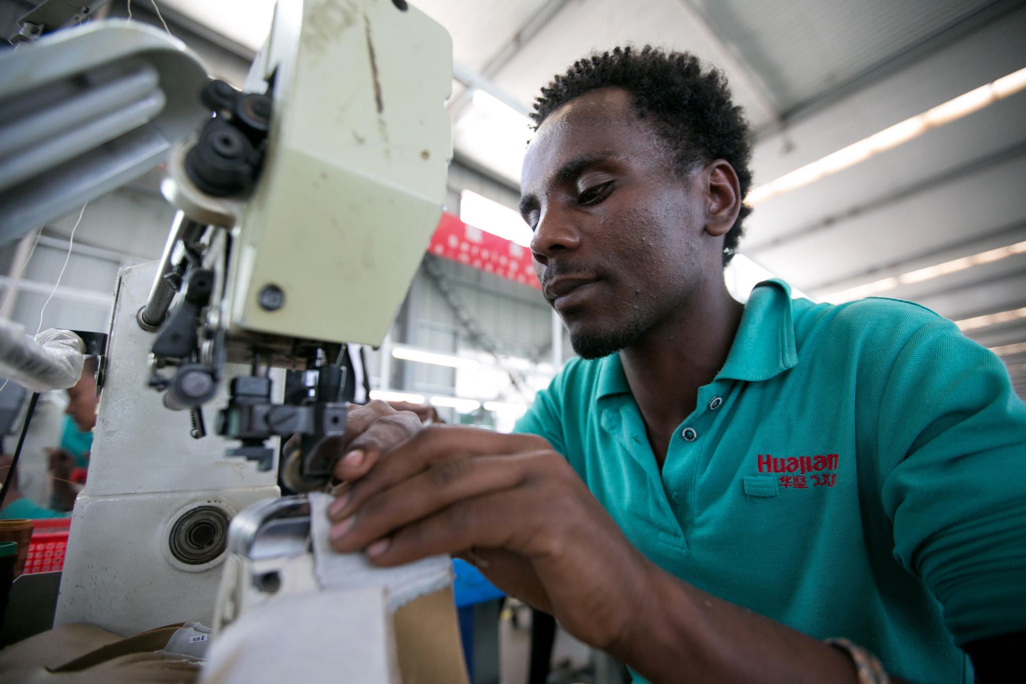 In the Chinese-owned Huajian Shoe Co. Factory in Addis Ababa, more than 6,000 workers build shoes for American brands such Tommy, Guess and Lucky. Image by Noah Fowler. Ethiopia, 2017.