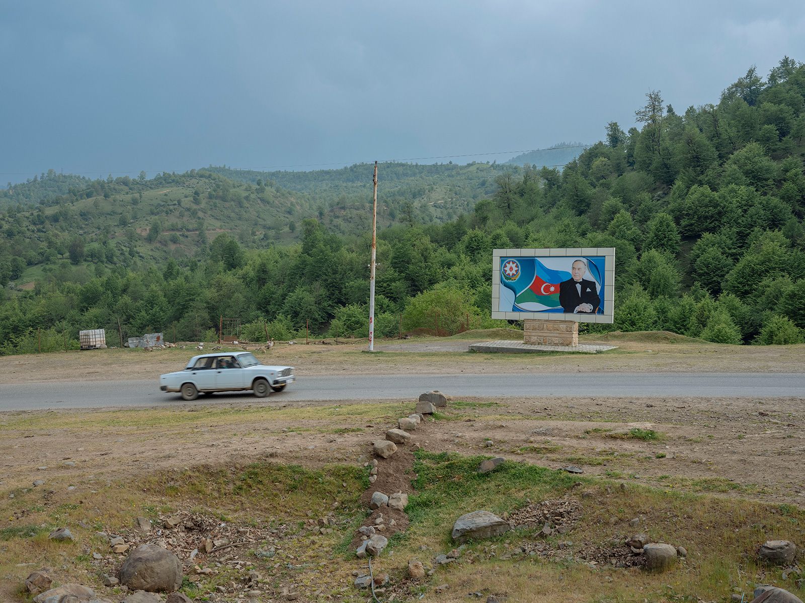 A billboard banner of Heydar Aliyev, former Azerbaigani president (1993-2003) seen near the road Talysh mountains in Lankaran. Image by Emin Özmen/Magnum Photos. Azerbaijan, 2018.