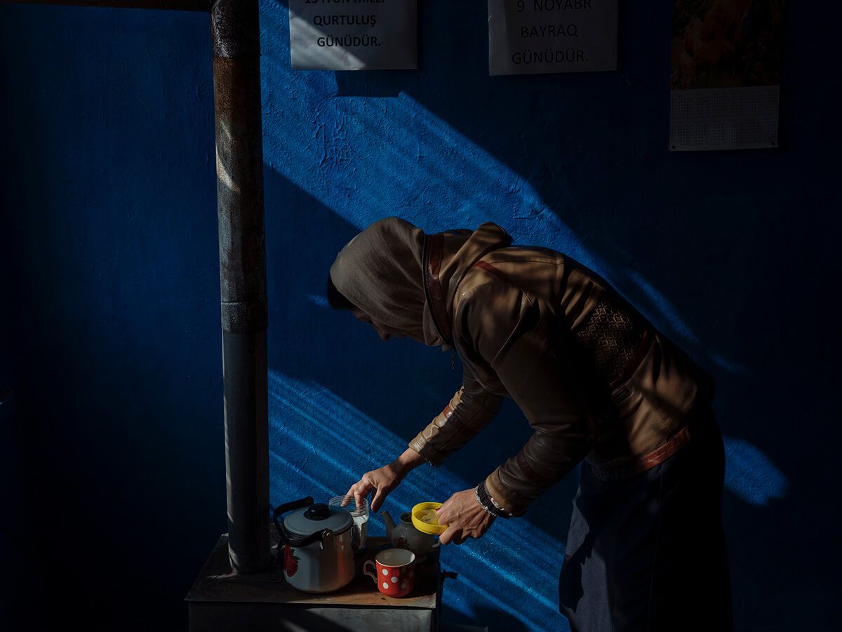 A woman prepares tea for the actors in the town theater in Kakalos village. Image by Emin Özmen/Magnum Photos. Azerbaijan, 2018.