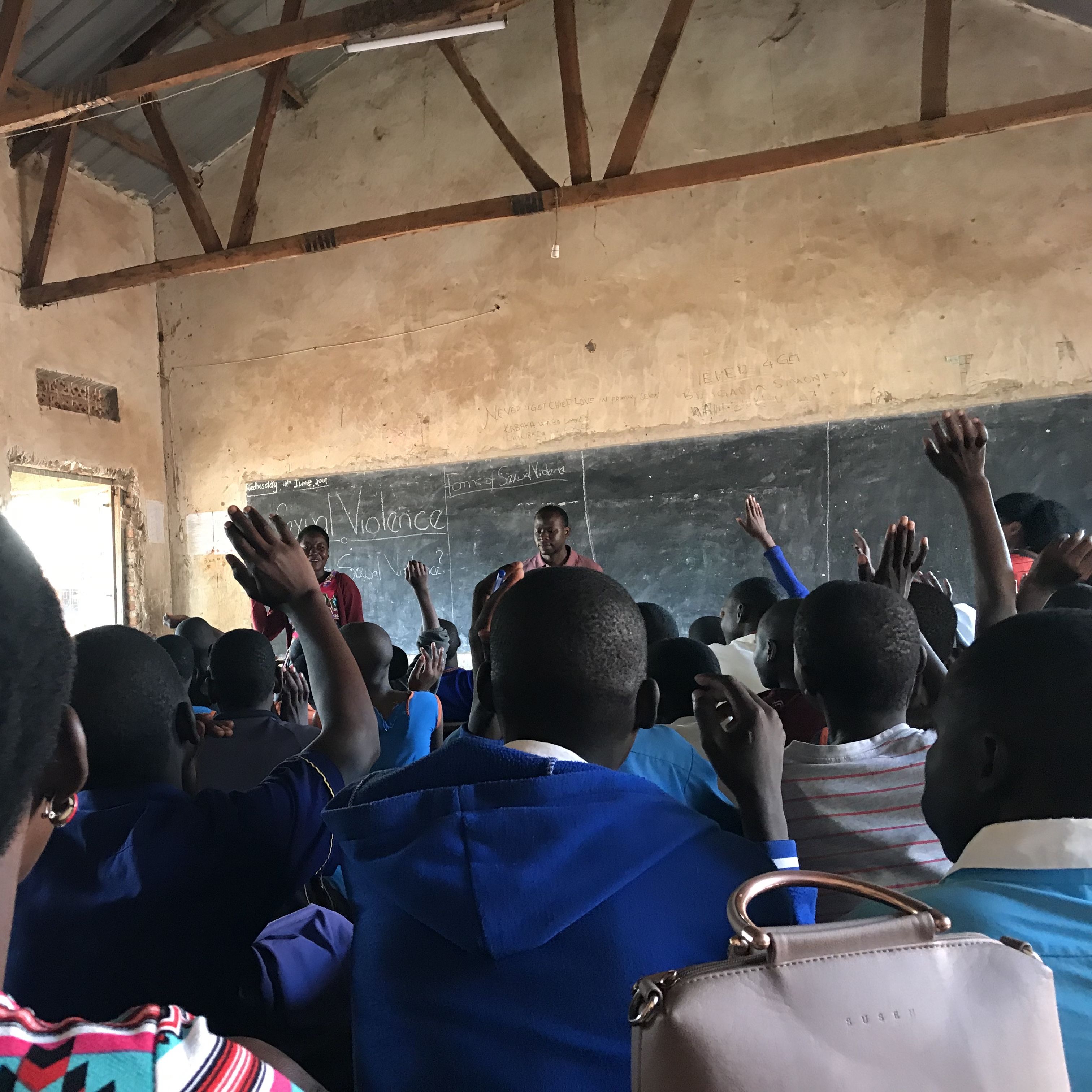 Students at a local elementary school attend an educational session on sexual violence led by members of the GIRLY Network team. Image by Keishi Foecke. Uganda, 2019.