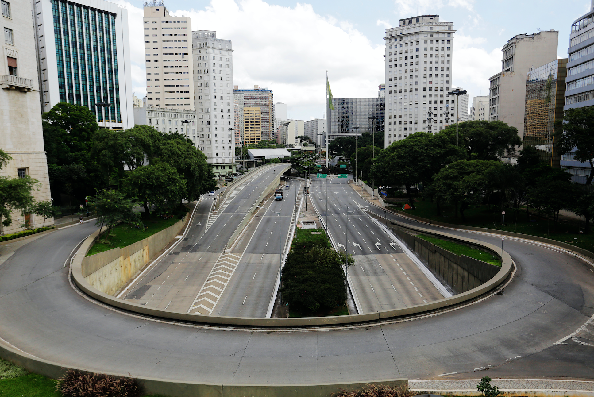 An empty street and avenue are seen in downtown São Paulo due to coronavirus outbreak. Image by Nelson Antoine / Shutterstock. Brazil, 2020.