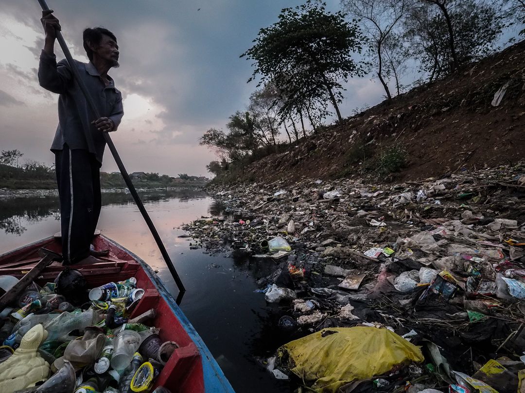 On some parts of Indonesia's Citarum River, trash is so thick, it will support person's weight. Image by Larry C. Price. Indonesia, 2016.