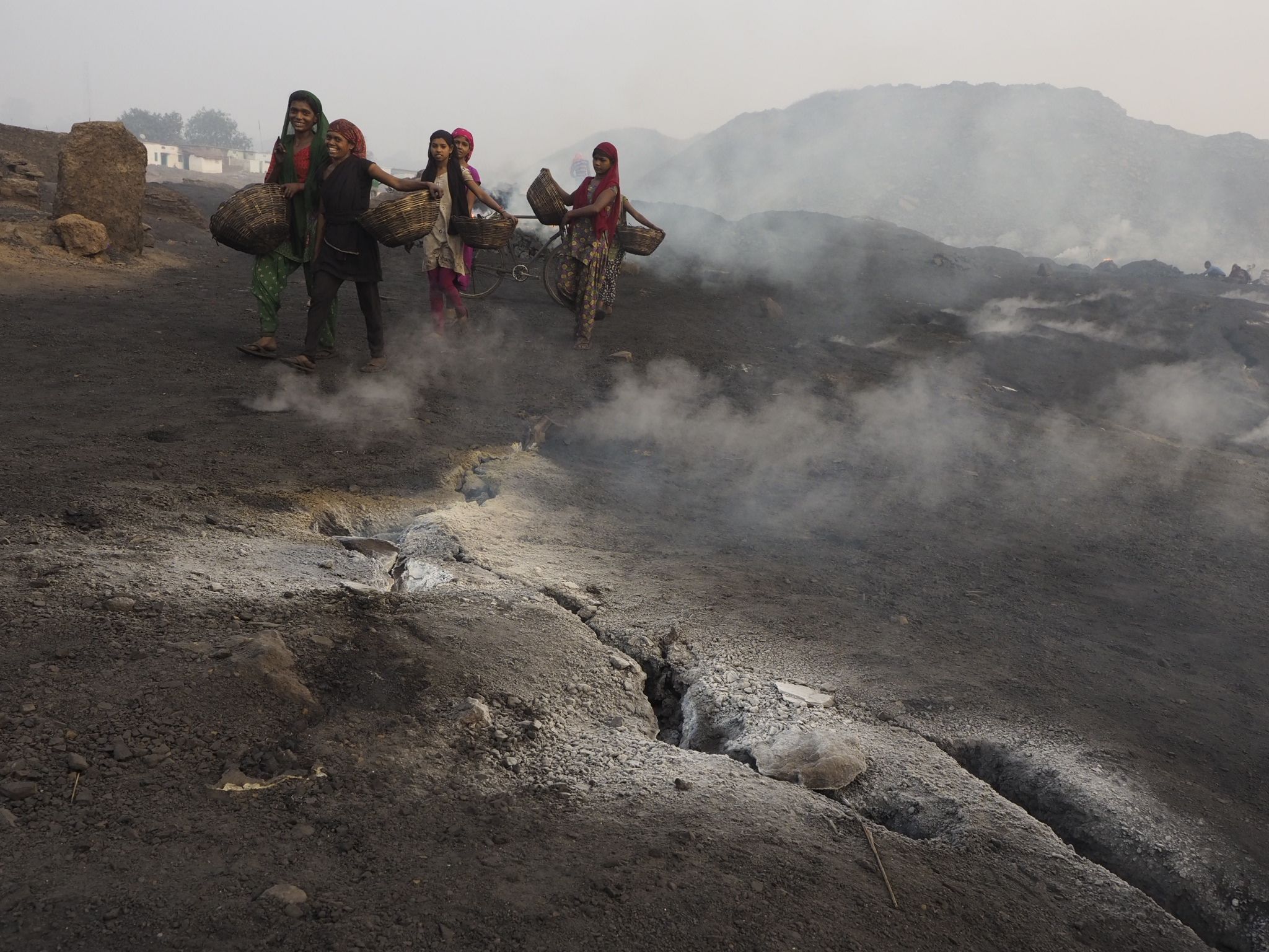 Smoke from underground coal fires release heat and toxic fumes at Ganshadih.