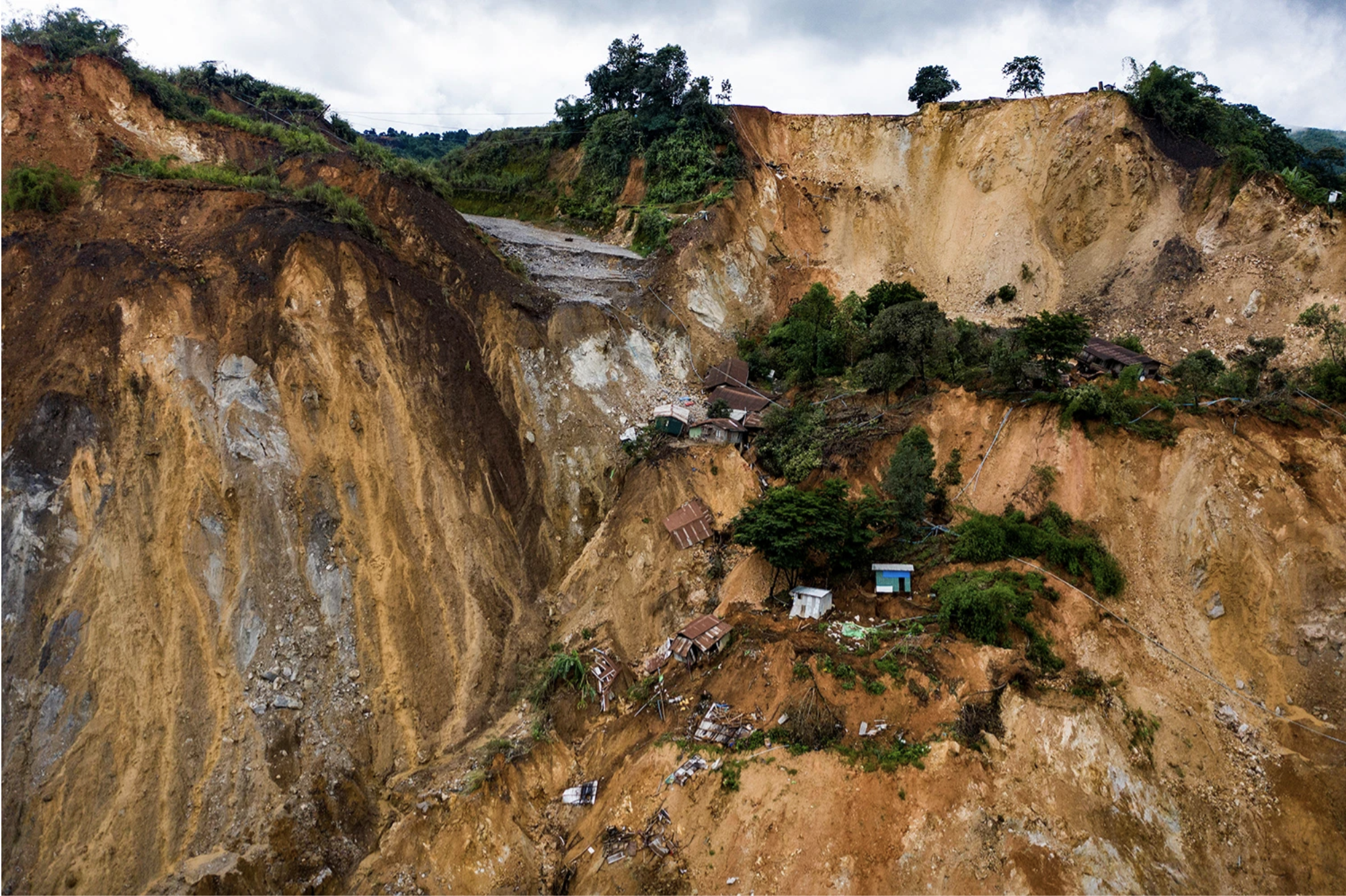 A landscape view shows a recent landslide at Gwi Hka jade mining site in Hpakant, Kachin state, Myanmar, on July 16. Image by Hkun Lat. Myanmar, 2020.
