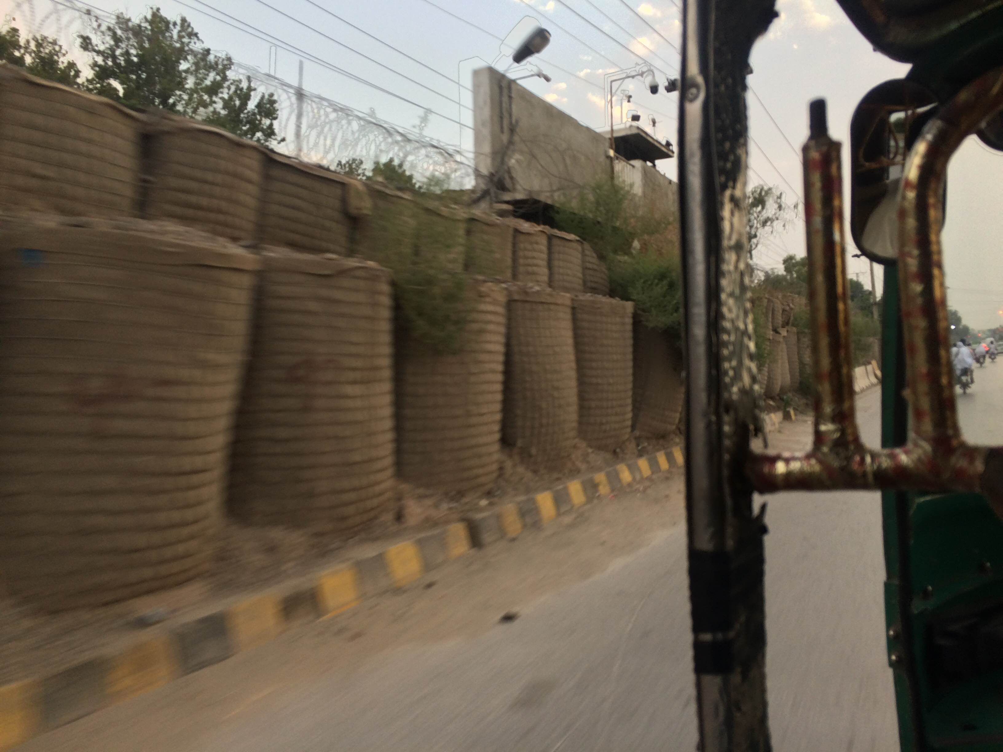 Walls of giant sand bags are now a common sight in Peshawar.  Image by Umar Farooq. Pakistan 2017.