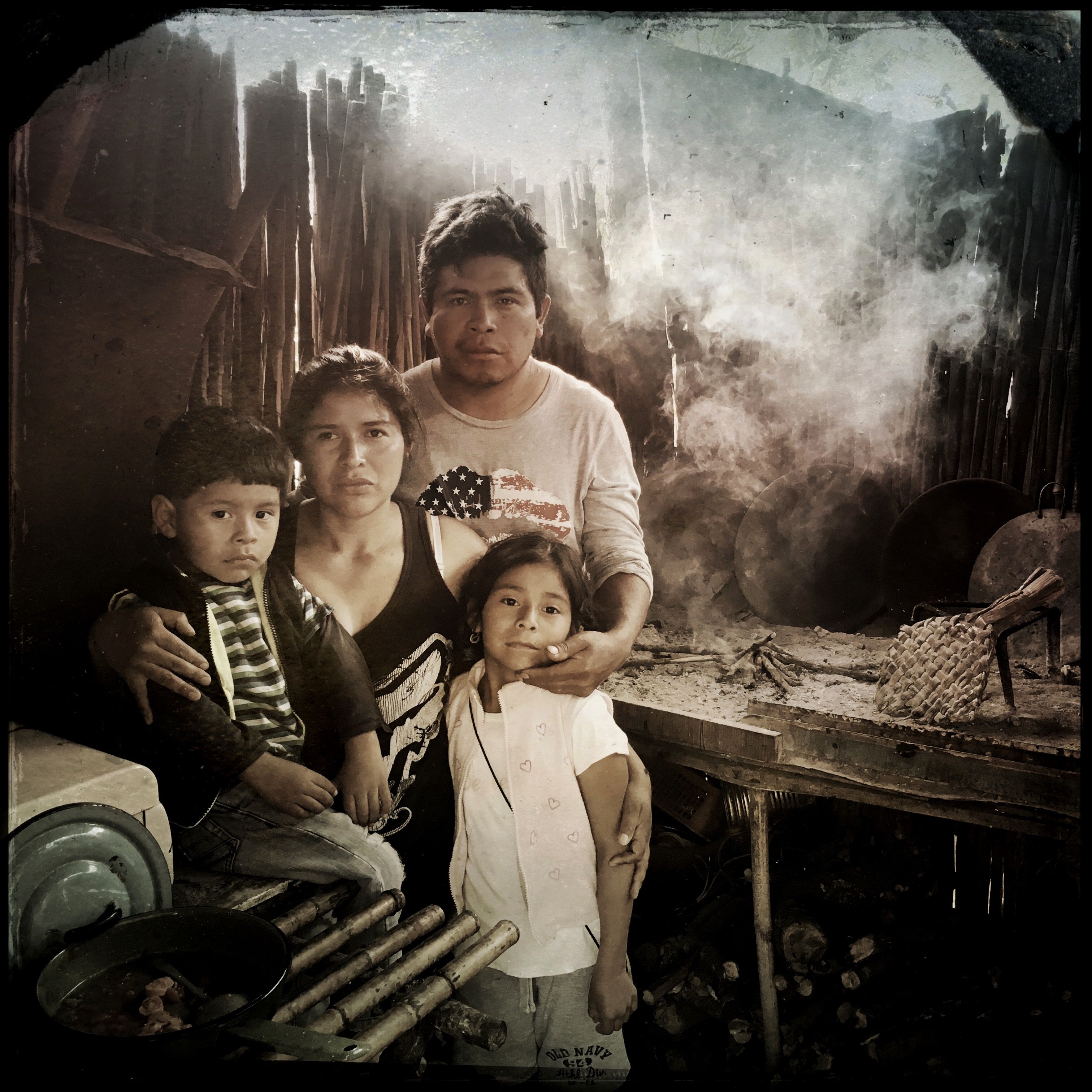 Maria García Cruz grew up with a gas stove in rural Guatemala, but she and her husband, Venancio Juárez, can't afford one. "I've never gotten used to this," she says of the smoke. Both of her children have respiratory problems. Photo by Lynn Johnson. Guatemala, 2017.
