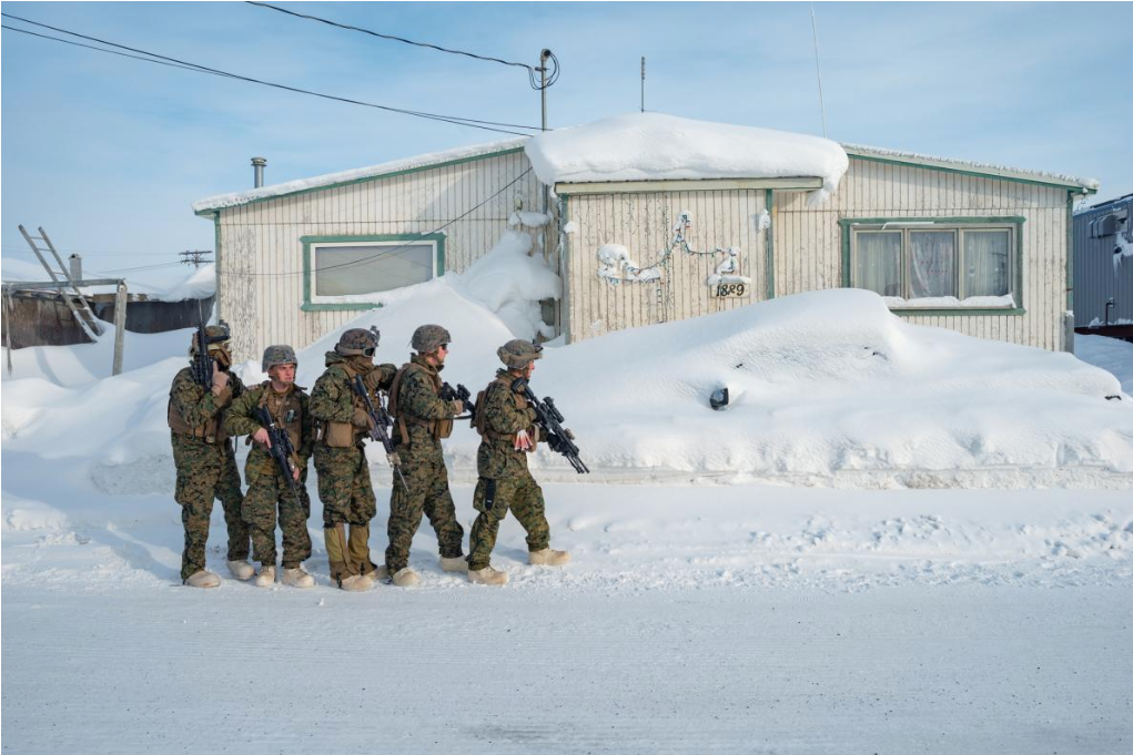 Marines simulate seizing a building in Utqiaġvik, Alaska, the northernmost city in the United States. Marine Corps commandant Gen. Robert Neller recently told senators that after years of focusing on the Middle East and Pacific, the Marines “had gotten back into the cold-weather business.” Image by Louie Palu. United States, 2019.