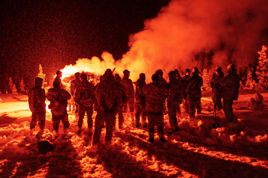 U.S. aviators practice deploying signal flares in the event of a crash or forced landing. With millions of square miles of empty, inhospitable landscape, the Arctic presents huge logistical challenges for search-and-rescue operations. Image by Louie Palu. United States, 2019.