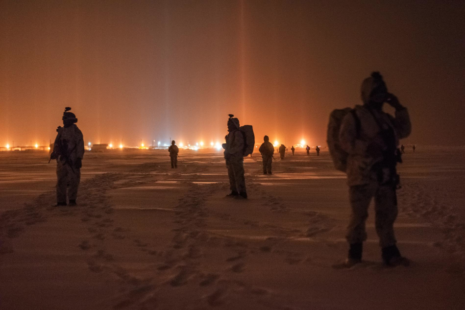 U.S. Special Forces troops and Marines simulate capturing an Arctic radar station at Point Barrow, Alaska, the nation’s northern­most point. Radar stations are key tools for tracking missile launches and incursions by Russian aircraft. Image by Louie Palu. United States, 2019.