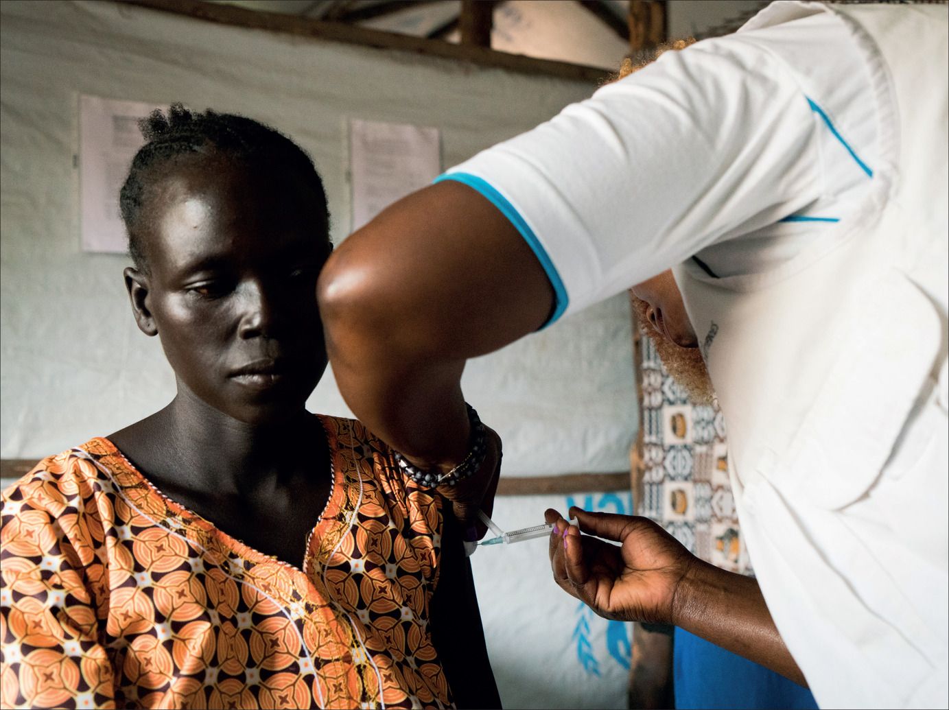 A patient receives her second hepatitis B injection at the Médecins Sans Frontières sexual violence and mental health clinic for refugees who have fled from South Sudan to Uganda.