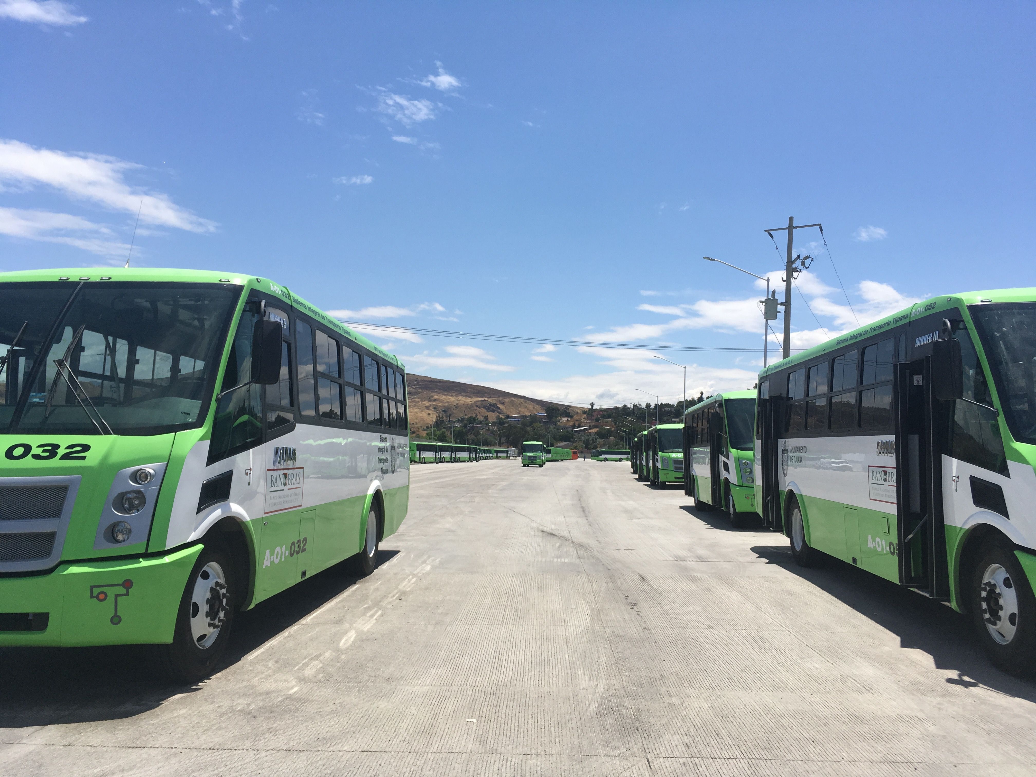 Buses for the SITT's rutas alimentadoras (feeder routes) lined up at the system's storage facility. Image by Patrick Reilly. Mexico, 2017.