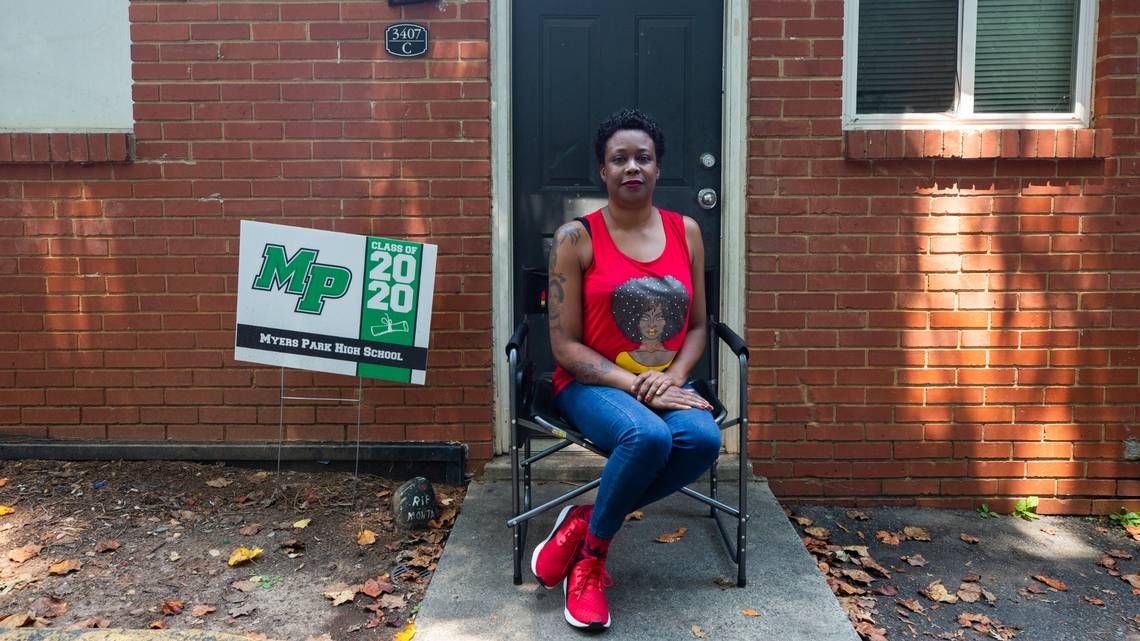 Yolanda Ames sits outside her Grier Heights apartment Wednesday, August 5, 2020. Ames, who cannot afford the internet, is among half of households in her neighborhood in Charlotte with no internet subscription. Image by Jessica Koscielniak. United States, 2020.