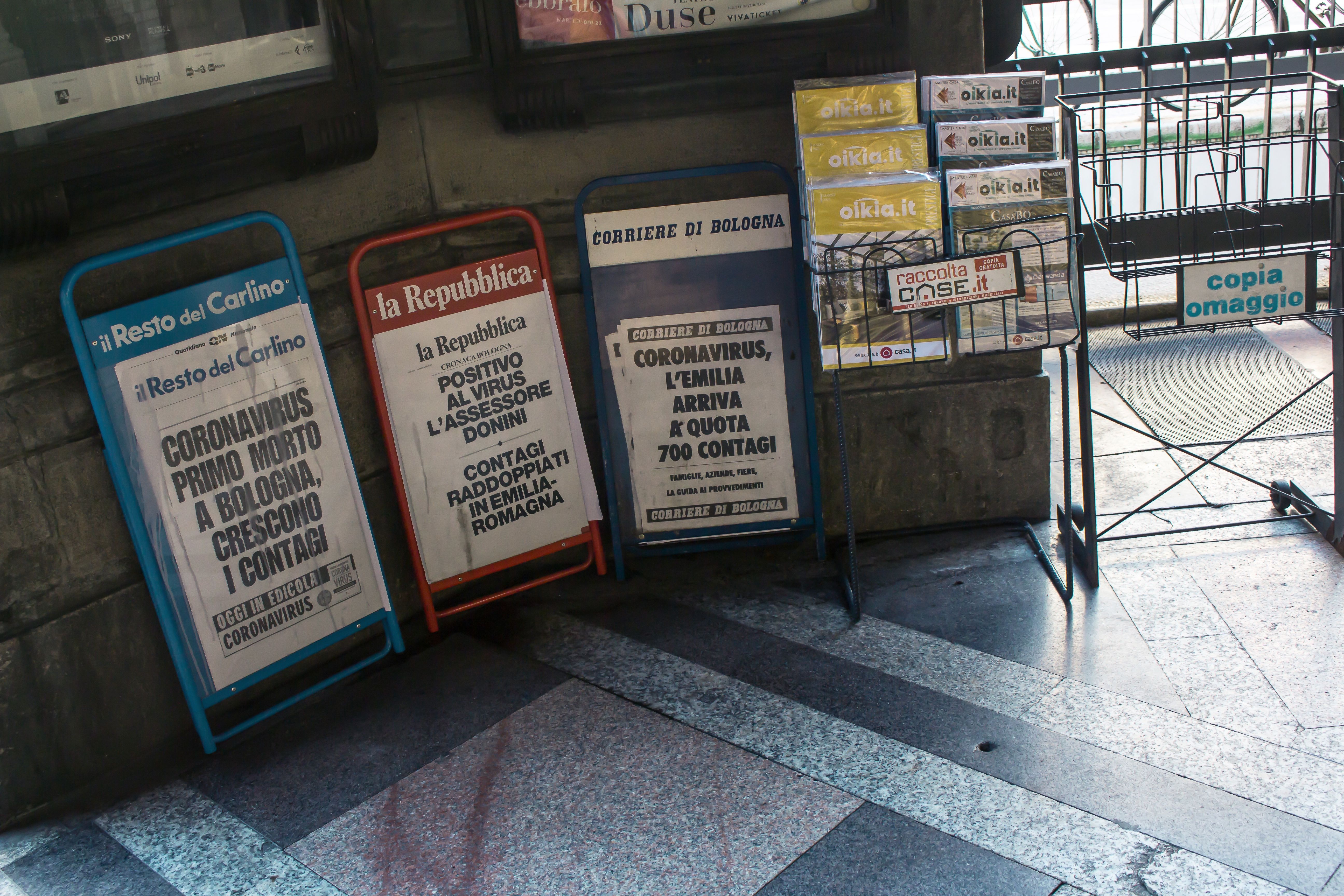 Newsstands in Bologna, Italy show headlines referring to the COVID-19 pandemic. Image by Angela M. Benivegna. Italy, 2020.