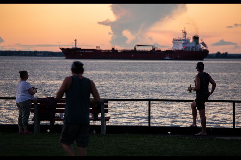 Near the eastern end of Lake Ontario, a freighter travels the St. Lawrence River at Cape Vincent, New York, on July 30, 2020. Image by Zbigniew Bzdak/Chicago Tribune. United States, 2020.

