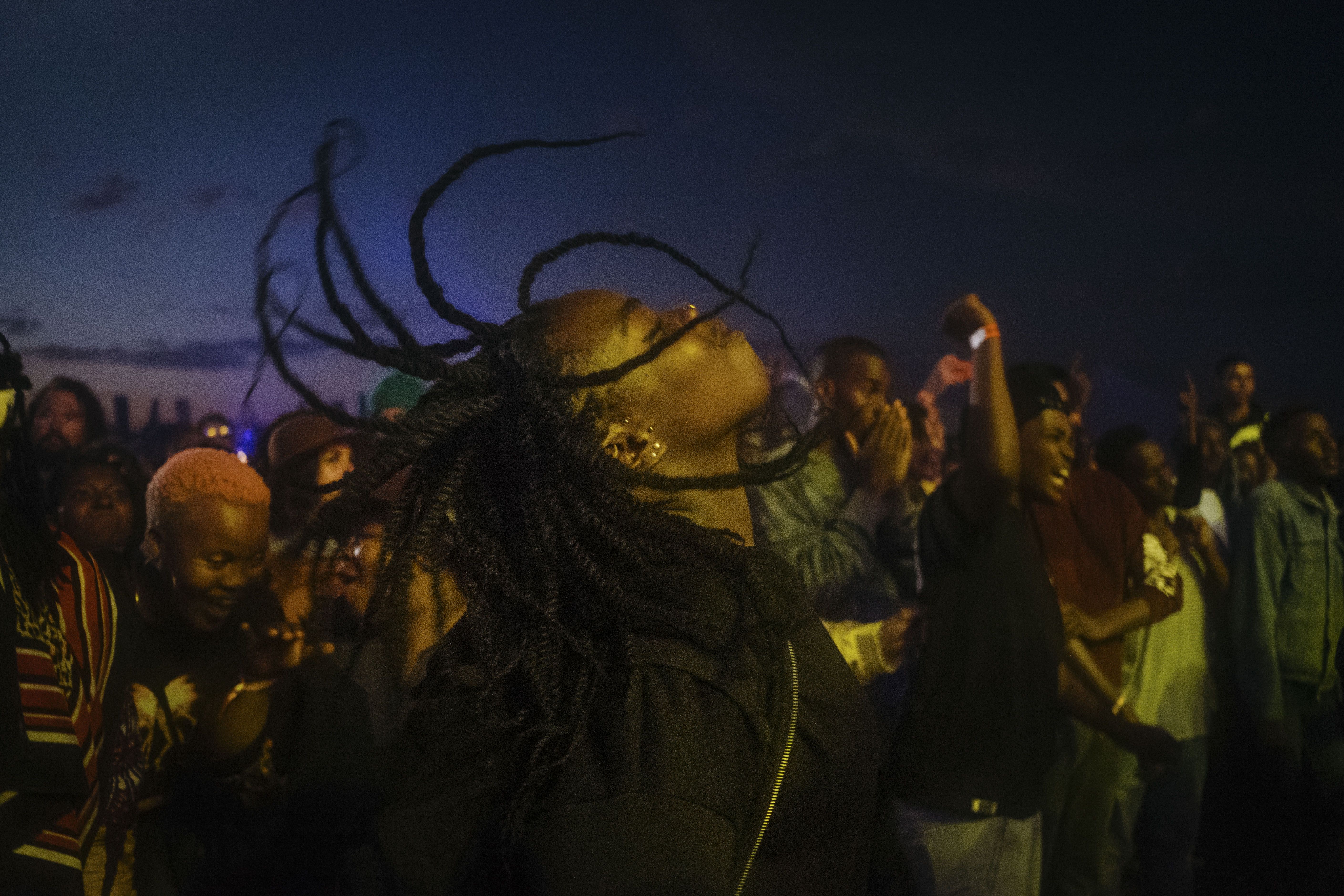 A music fan dances in a mosh pit at the African debut event of the Afropunk music festival hosted at Constitution Hill in Johannesburg. Image by Melissa Bunni Elian. South Africa, 2017.