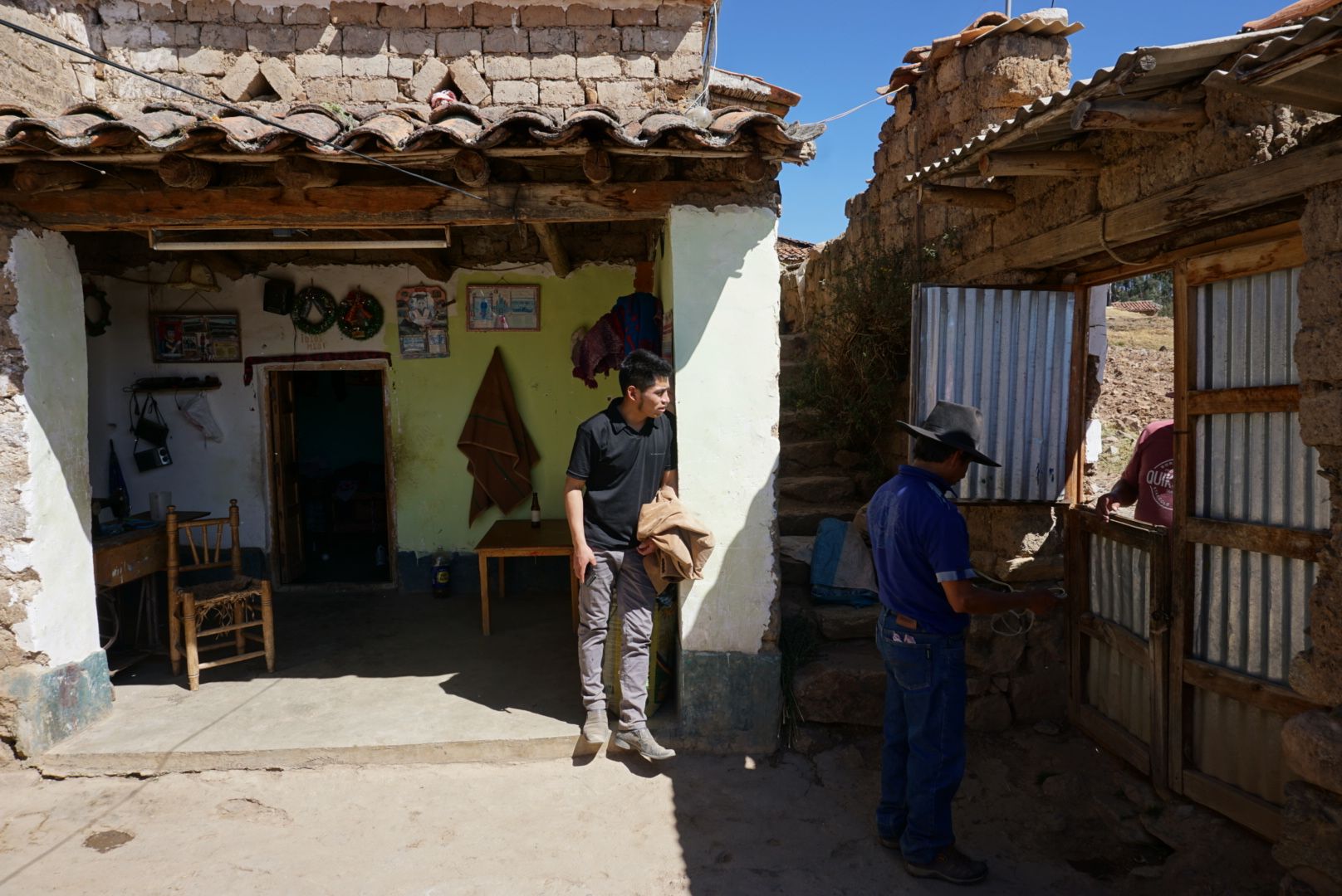 Clinton (center) works in Huaraz, but makes the three-hour journey to visit his parents in their village once a month. Image by Audrey Fromson. Peru, 2019.