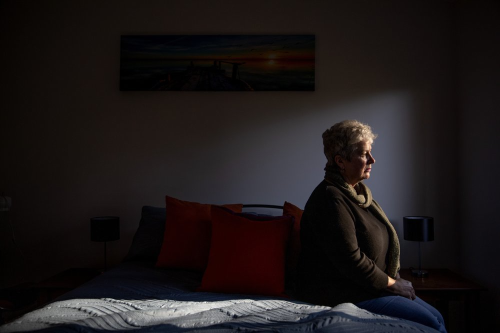 Deb Ware sits for a photo in the room of her home where her son Sam had been staying periodically for the past three years while battling an opioid addiction, in Fountaindale, Central Coast, Australia, Thursday, July 18, 2019. For three years, Deb has battled to save Sam's life, a lonely war against a system that made pharmaceutical opioids cheap and easy to get, in a country that has quietly endured what was once thought to be a uniquely American crisis of skyrocketing opioid addiction and deaths. Image courtesy of David Goldman. Australia, 2019.